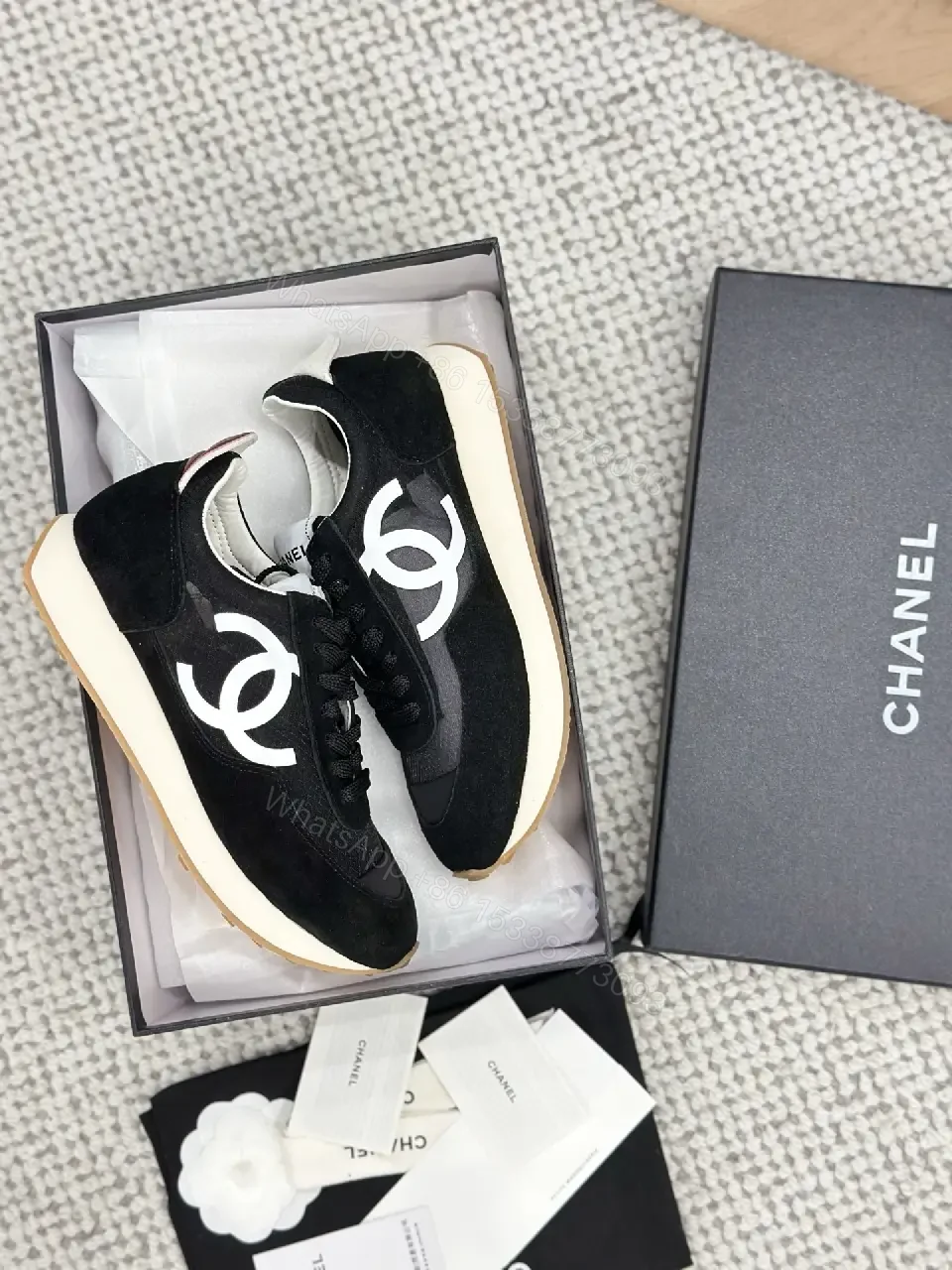 View 5 of Sleek Black Knit High-Top Sneaker with Signature Emblem, Luxury