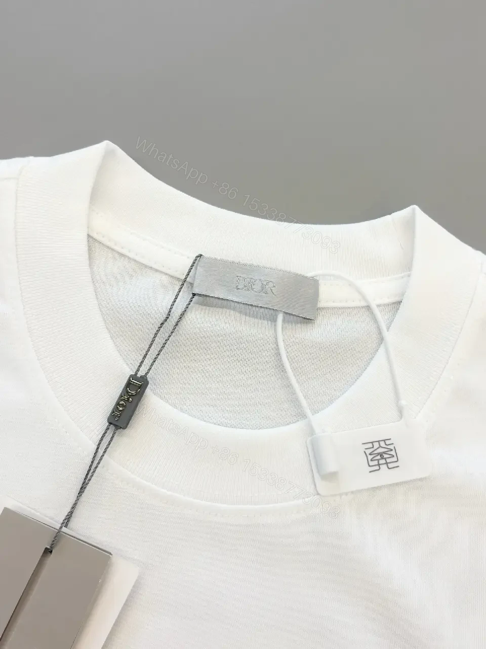 View 4 of Minimal White Tee with Bold Logo Luxury Graphic Tee