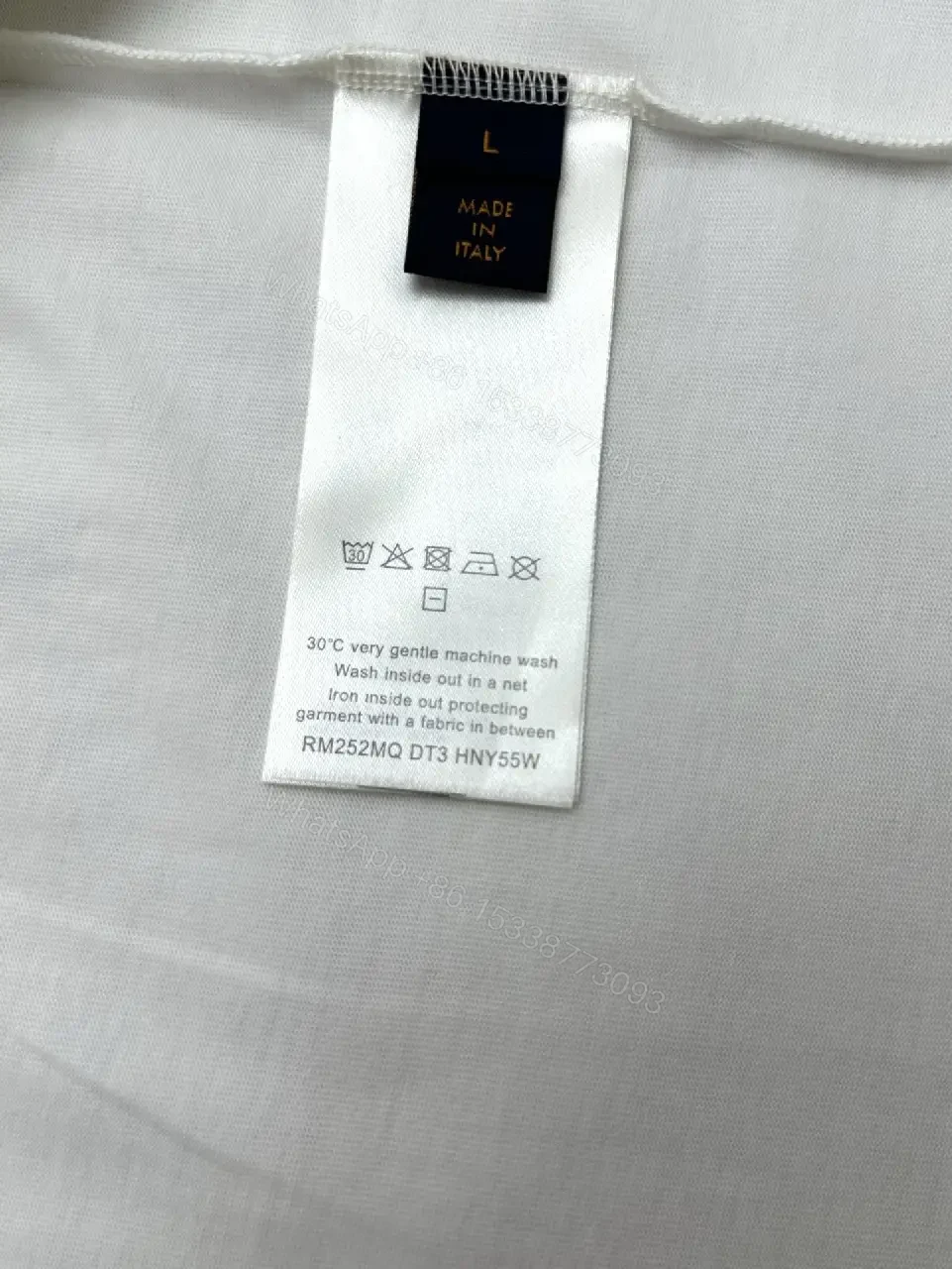 View 9 of Minimalist Luxe White Crewneck with Subtle Embossed DetailTop