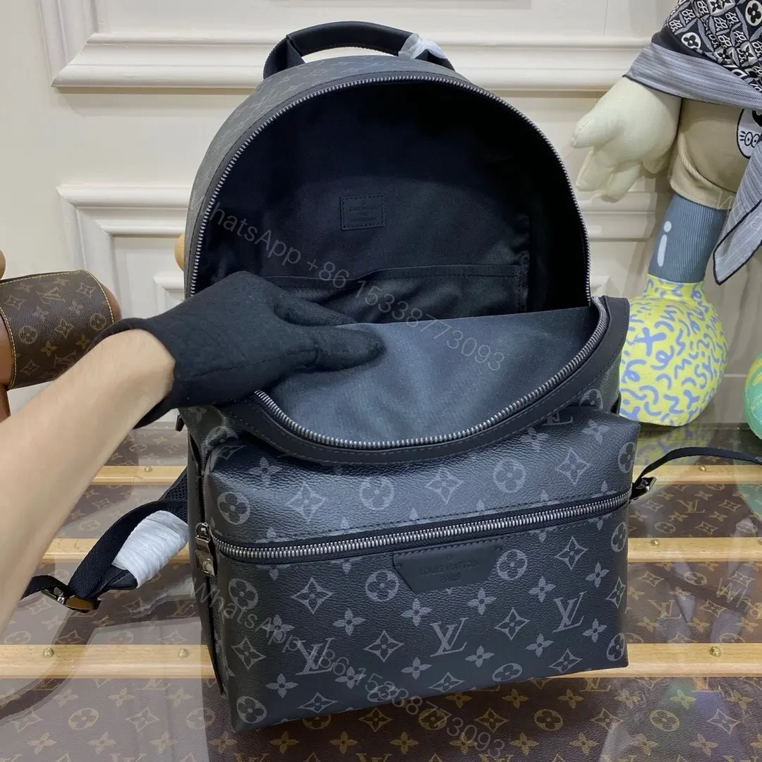 View 2 of Louis Vuitton Discovery Backpack in Monogram Eclipse canvas