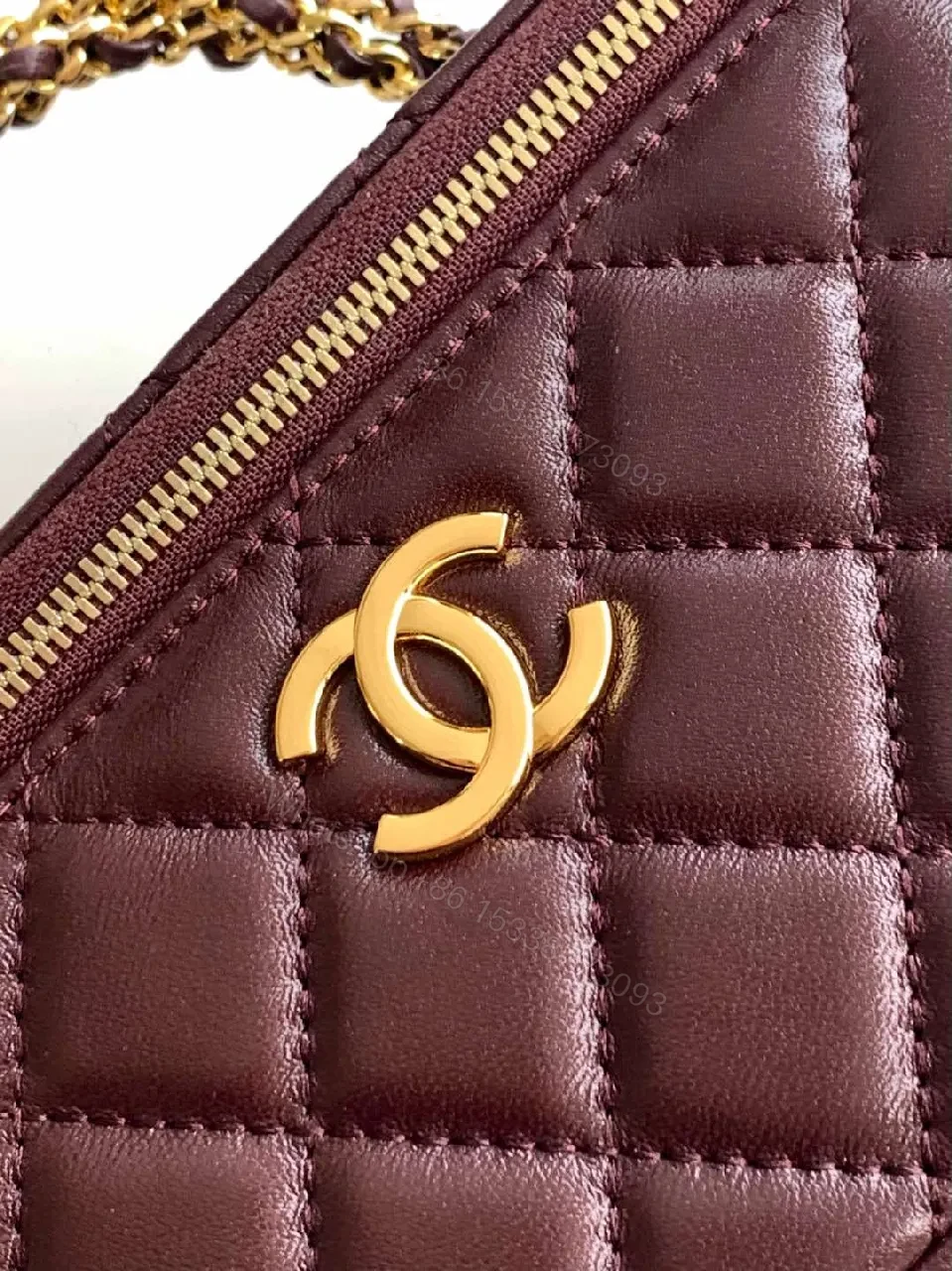 View 4 of Quilted Burgundy Bag with Gold Chain Handle—Compact Luxury