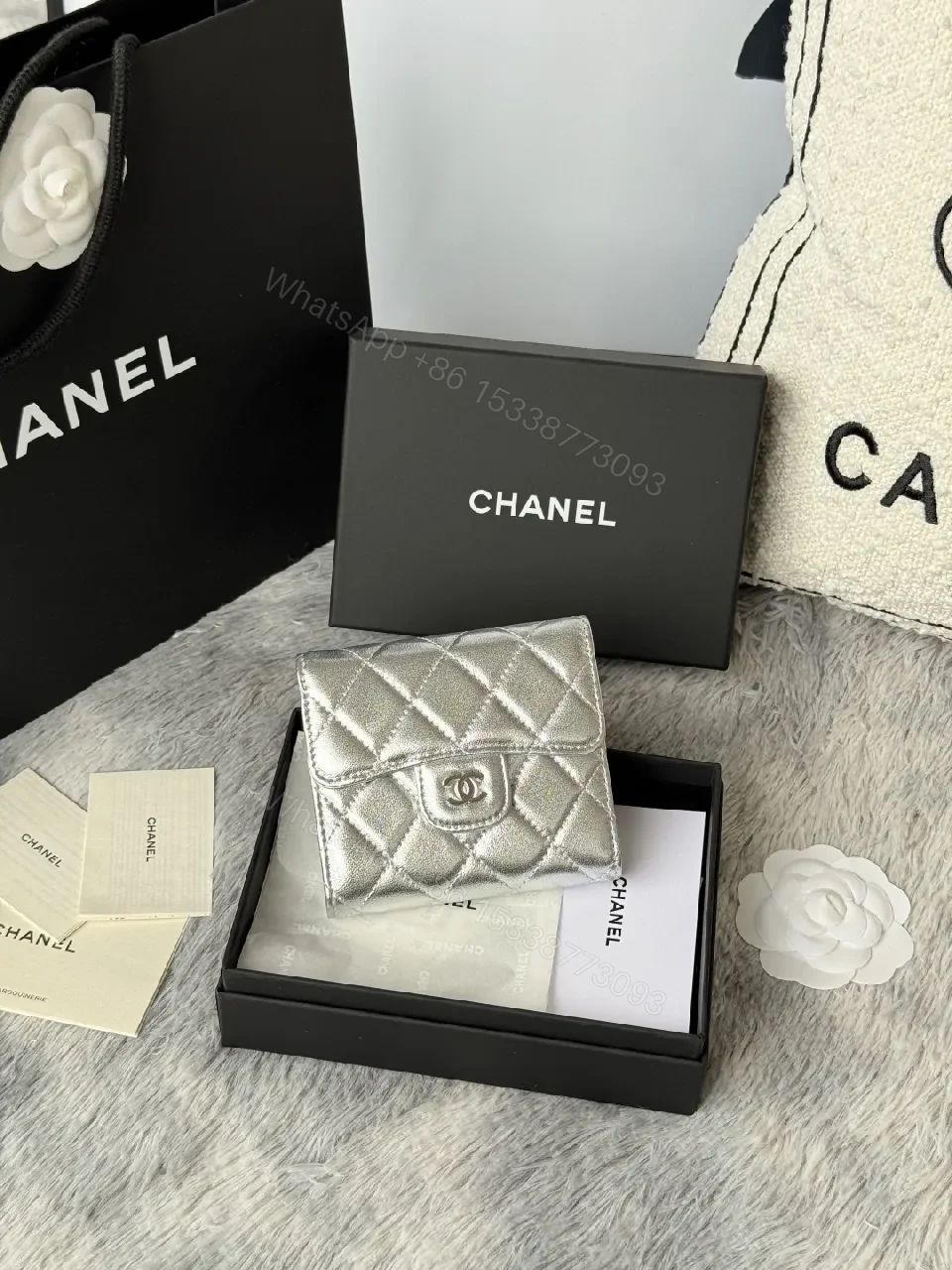 Compact Silver Quilted Wallet with Signature Hardware — view 1