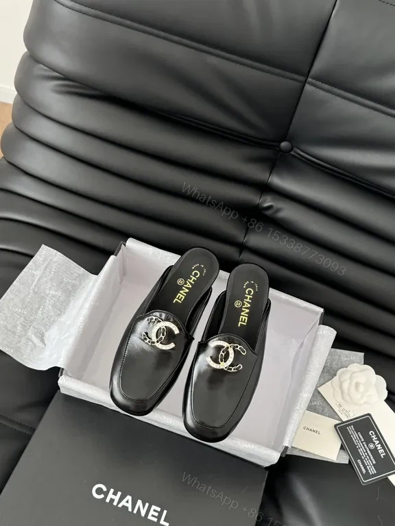 Chanel-Inspired Black Leather Slip-Ons with Signature Hardware — view 1