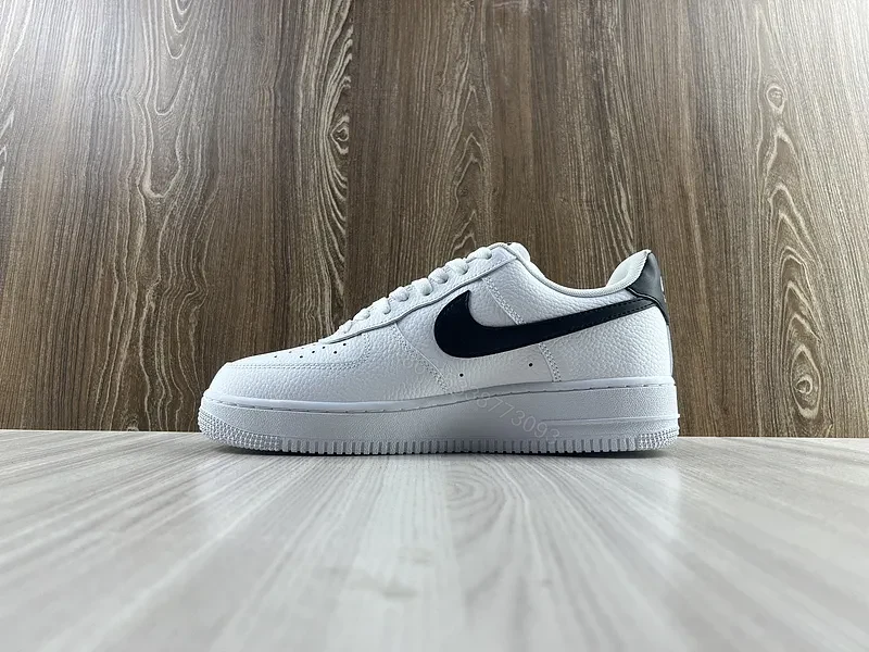 View 7 of White Leather Sneaker + Leather + Minimalist + Bold Swoosh + Classic Air Force Style
