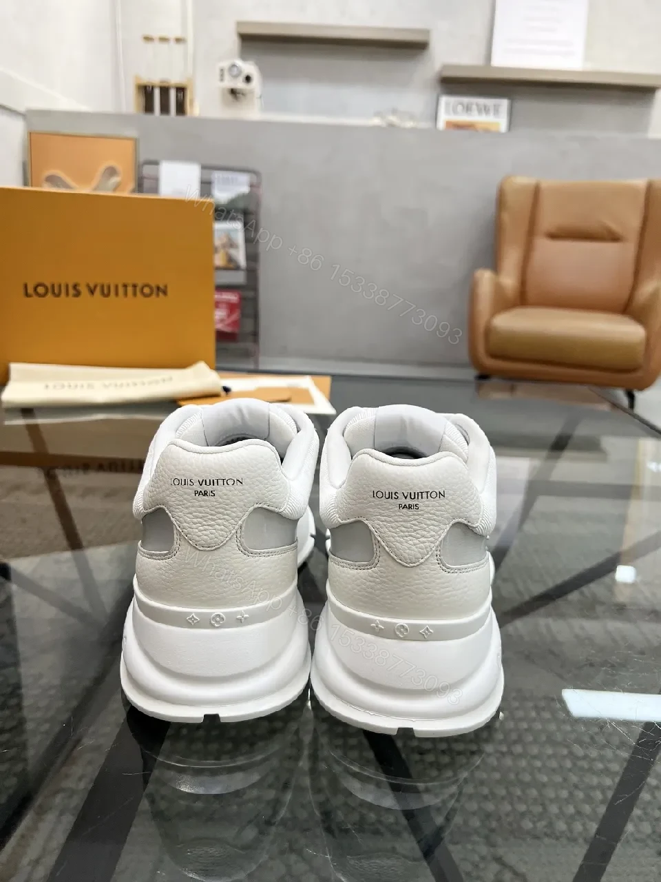View 9 of White Leather Minimalist Luxe Sneakers with LV Detail