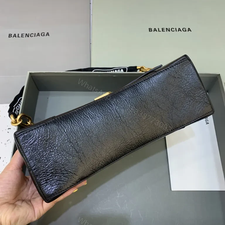 View 7 of Chic Black Leather Crossbody with Bold Gold Hardware Bag