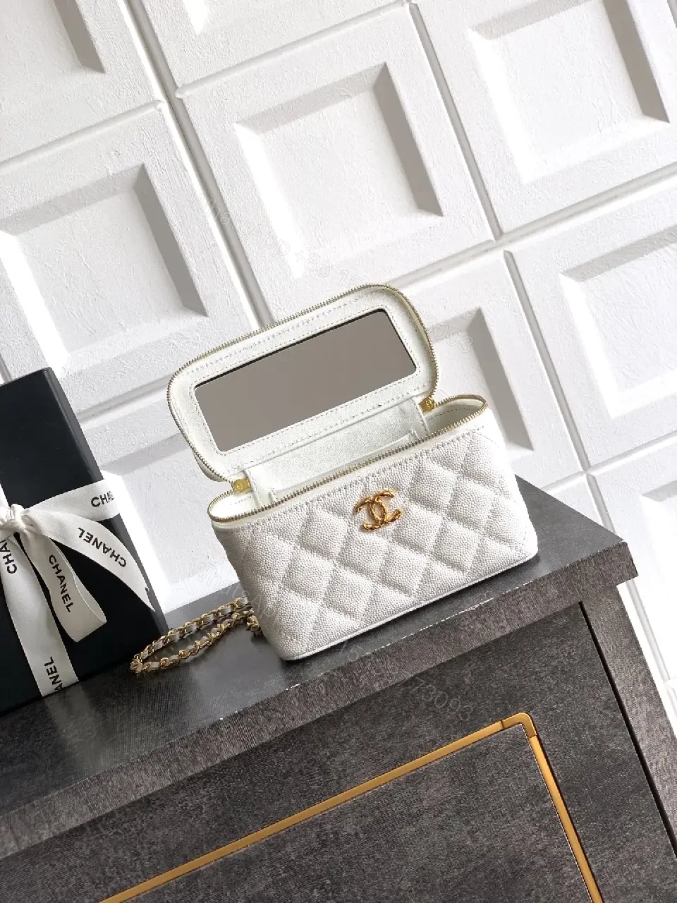 View 4 of white quilted leather bag with chain strap for everyday luxury