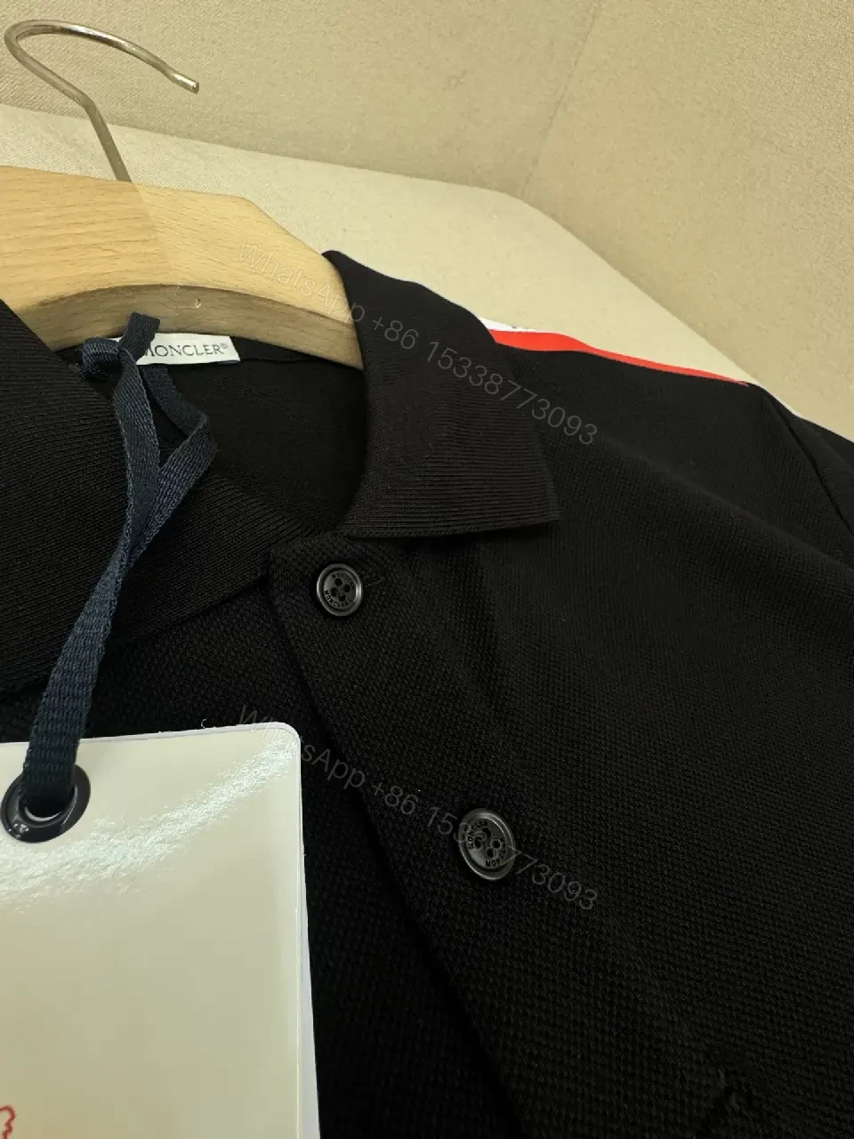 View 6 of Navy cotton polo shirt with red-white striped shoulder accents for everyday luxury