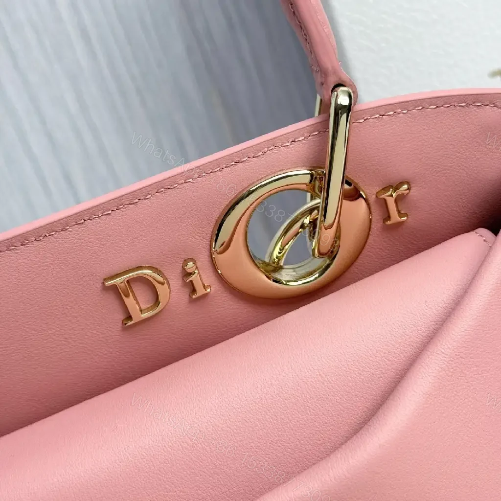 View 8 of Soft Pink Faux-Leather Satchel: Bow Accent, Sculpted Diagonal Panels, Crossbody Comfort