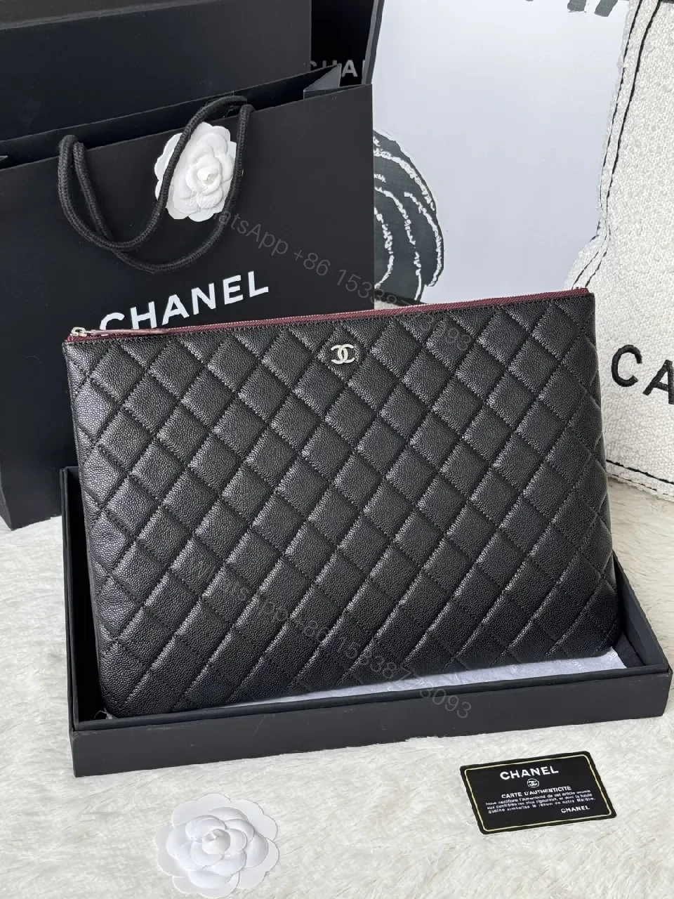 Compact Black Quilted Leather Clutch with Silver Logo — view 1