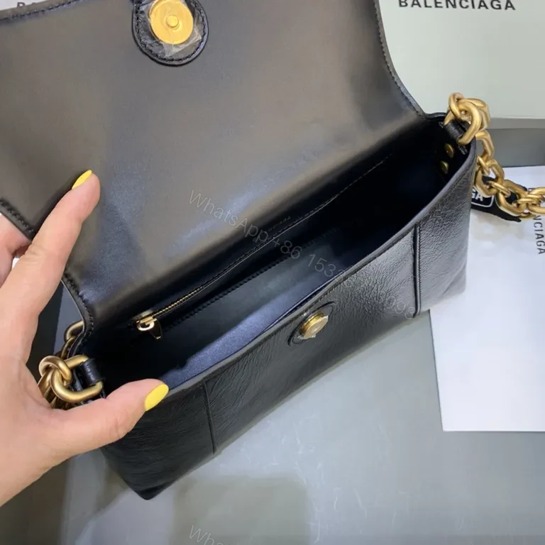View 3 of Chic Black Leather Crossbody with Bold Gold Hardware Bag