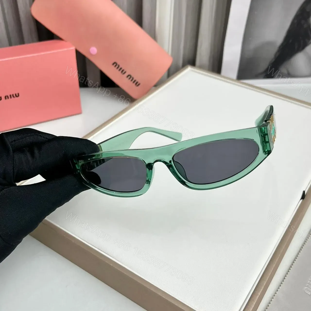 View 2 of Miu Miu Cat Eye Green-Black Sunglasses One Size