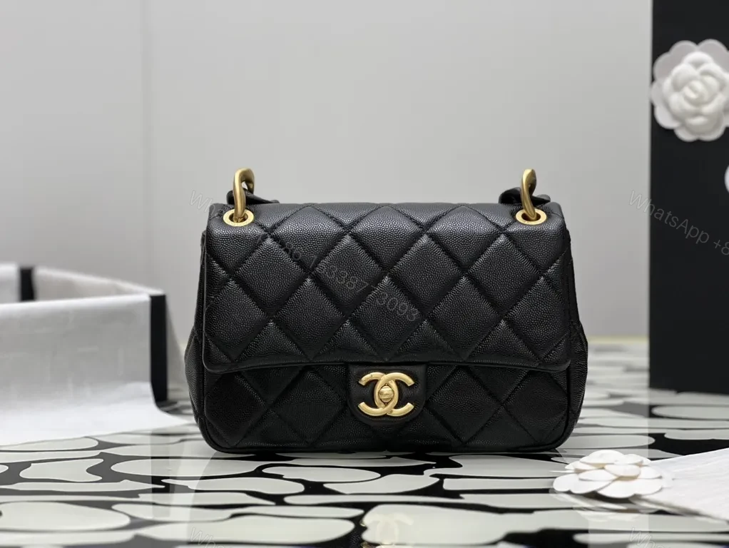 Compact Quilted Black Flap Bag with Gold Hardware, Chain Carry — view 1