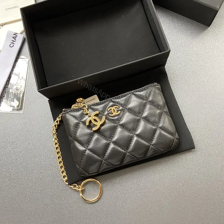 Compact Black Quilted Wallet with Gold Chanel Charm – Everyday Luxury — view 1