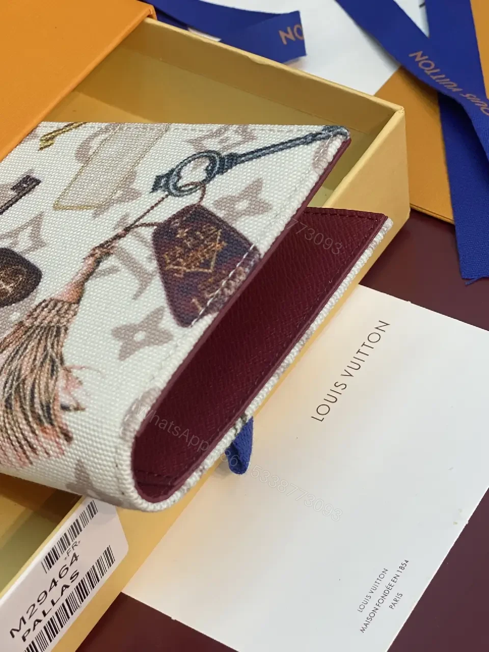 View 2 of Off-White Beige Monogram Clutch with Tassel Accent