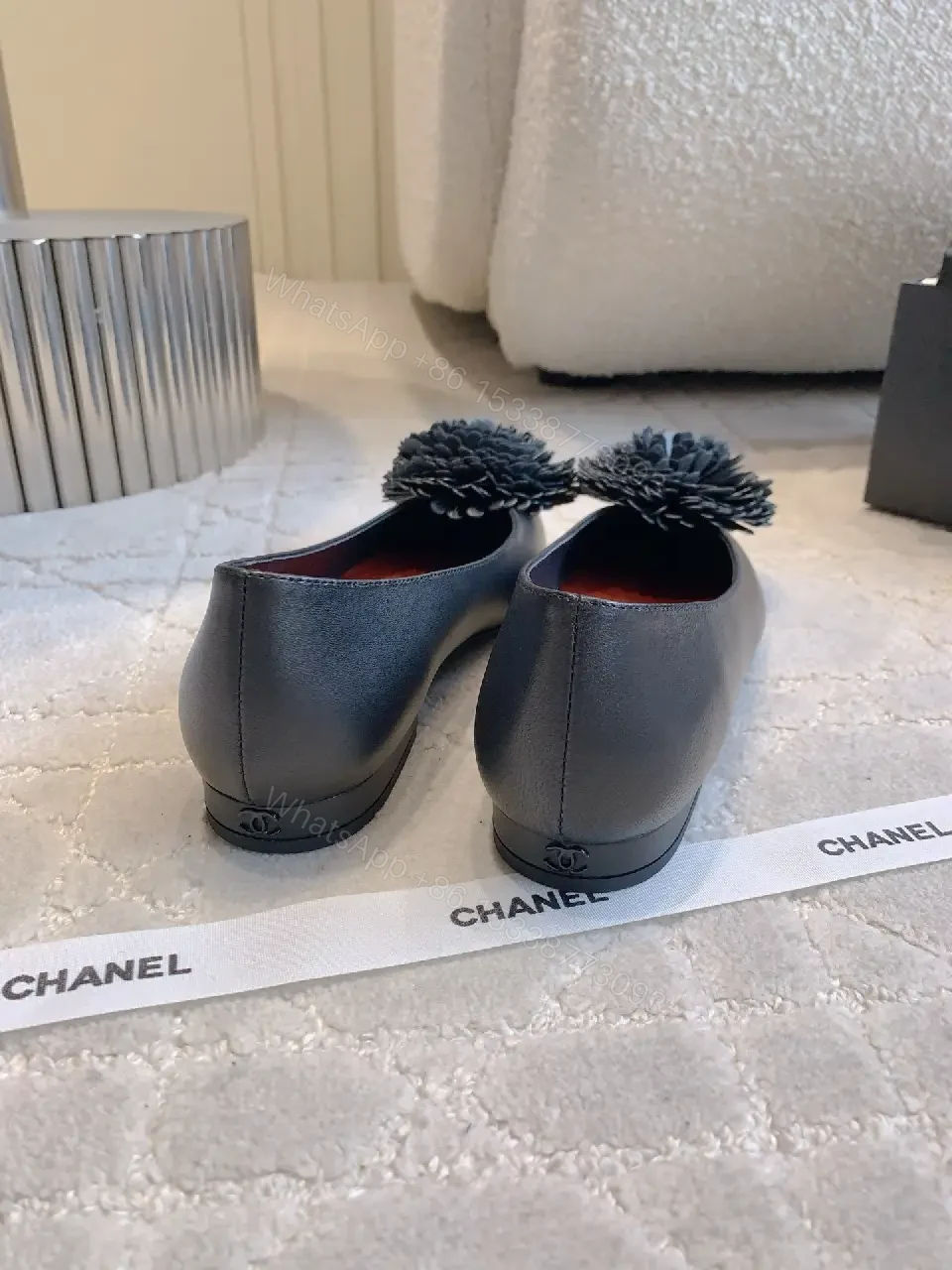 View 6 of Chic Black Pointed Flats with Floral Pom-Pom Detail