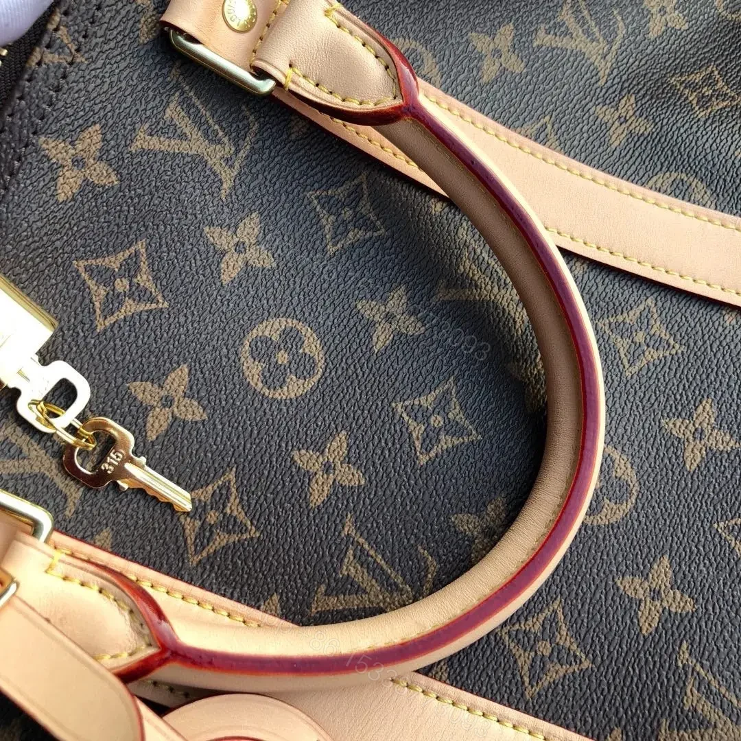 View 4 of LV Monogram Canvas Keepall Bandoulière 55 Leather Duffle Bag
