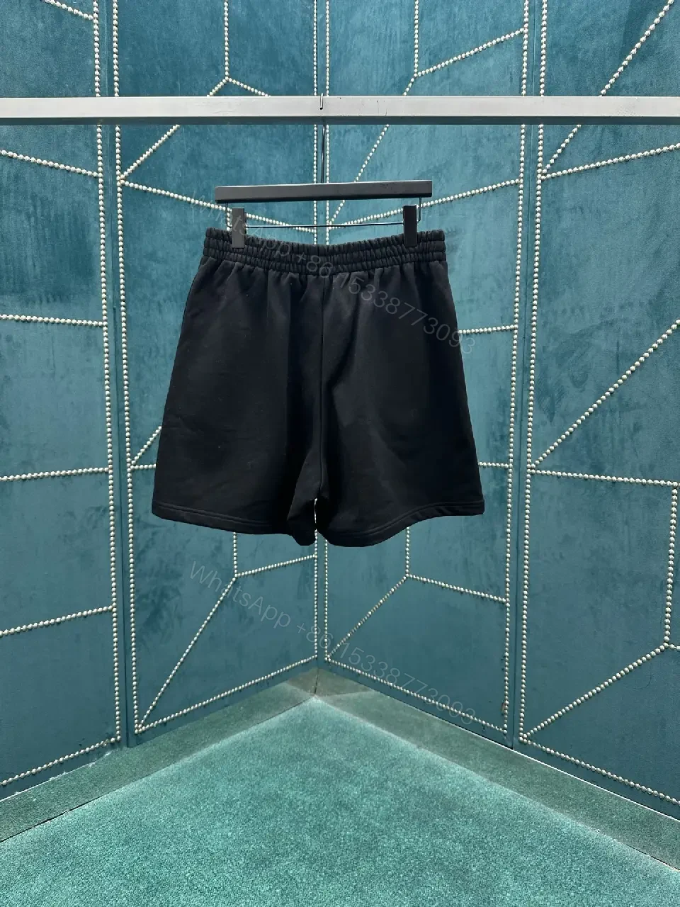 View 4 of Black Quick-Dry Swim Shorts | Minimalist, Structured, All-Day Comfort