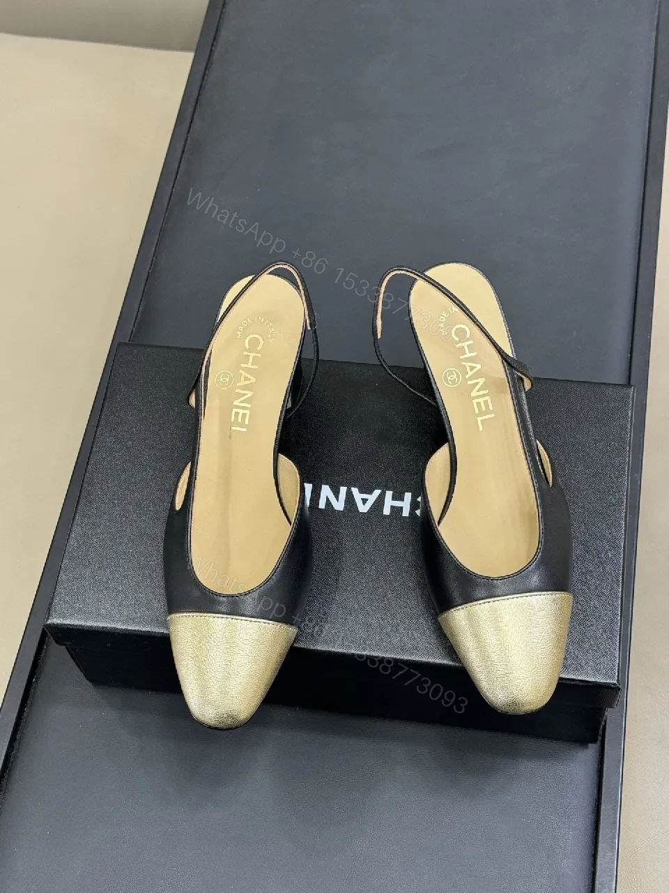 View 9 of Elegant Slingback Pumps: Black Leather with Metallic Cap Toe