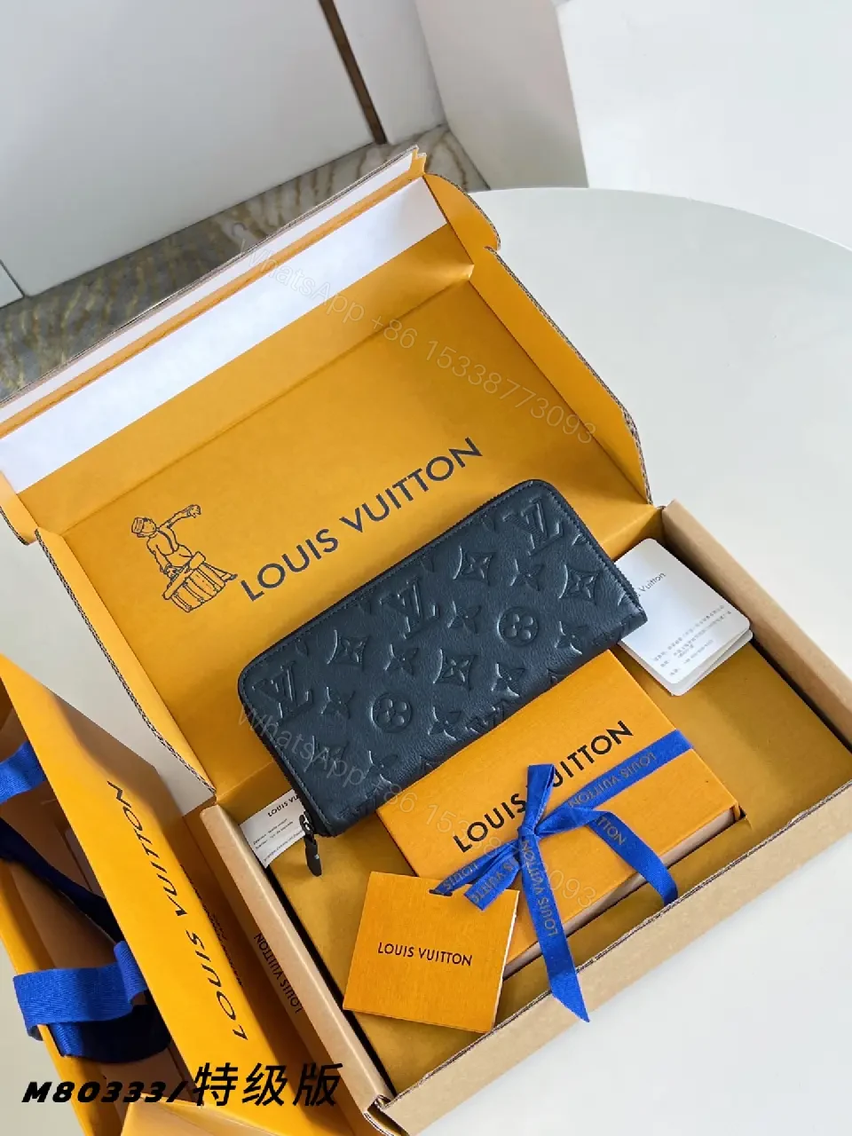 View 6 of Navy Leather Zip Continental Wallet with LV Embossed Monogram