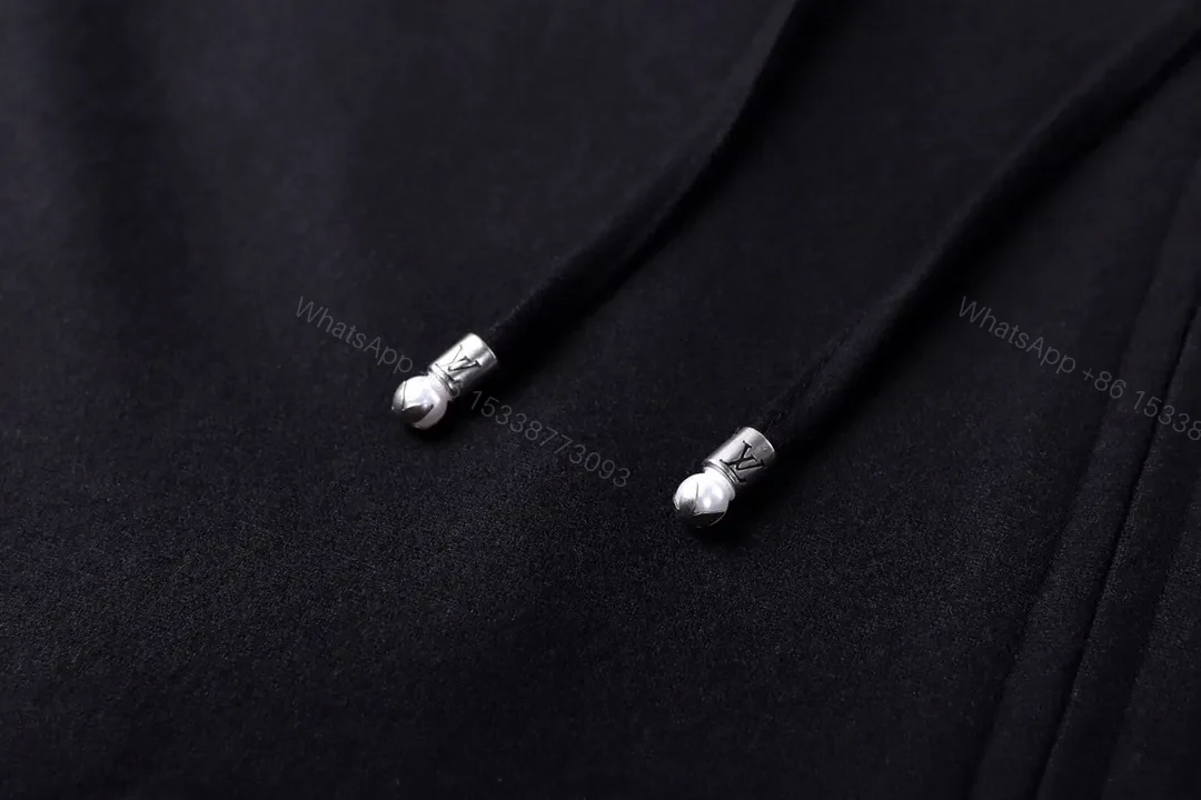 View 10 of Classic Black Zip Hoodie with Subtle LV Accent — Essential, Versatile Luxury