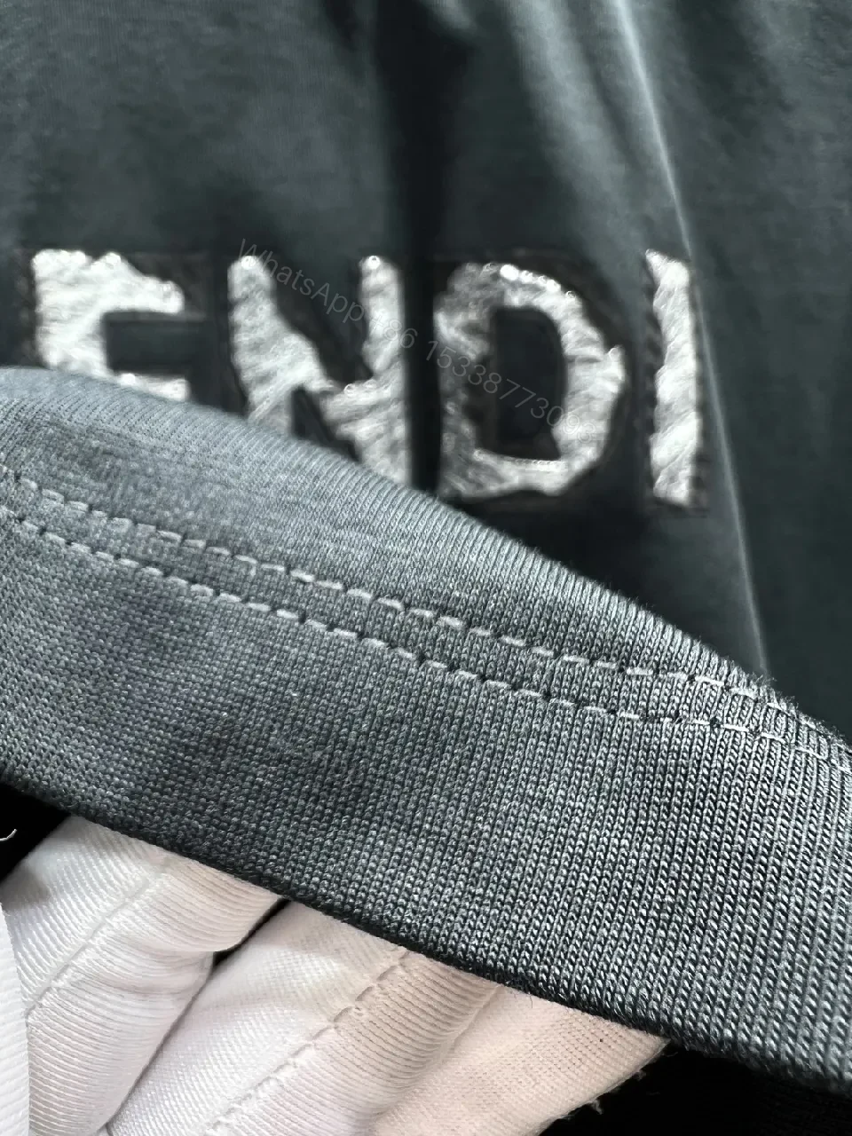 View 7 of Minimalist Black Cotton Tee with Elevated Logo Texture
