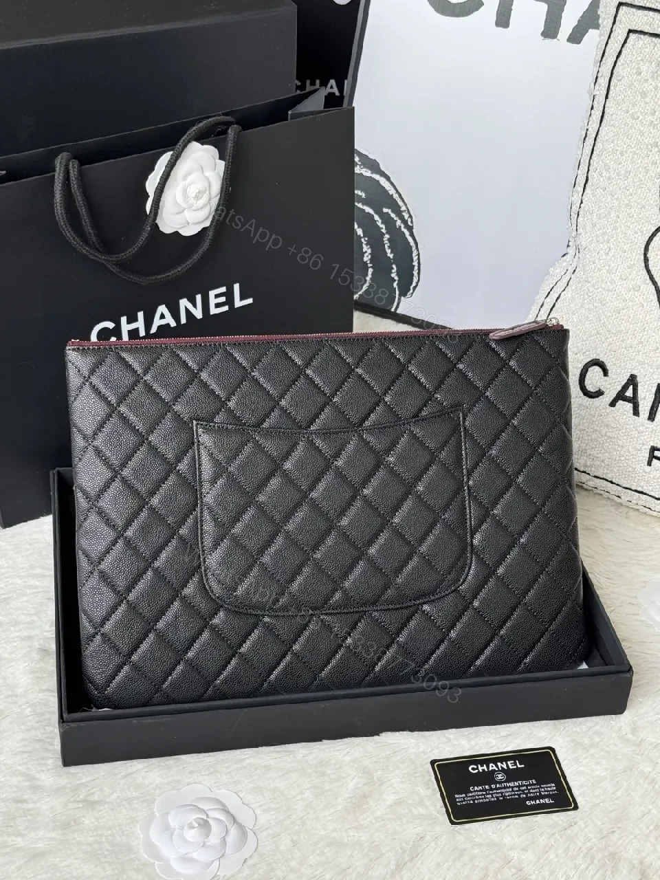 View 5 of Compact Black Quilted Leather Clutch with Silver Logo