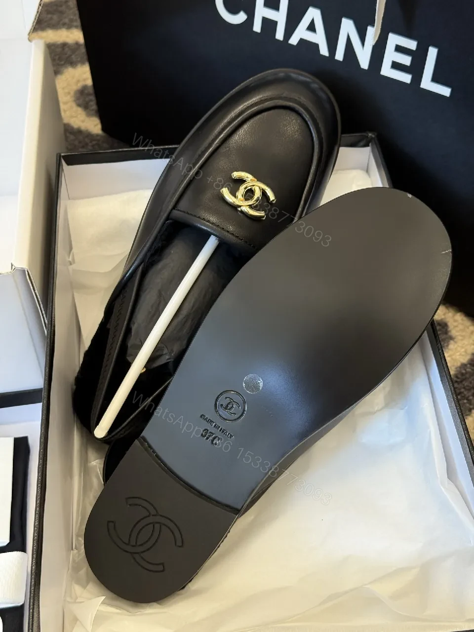 View 4 of Sleek Leather Loafers: Timeless Chic with Gold Logo Hardware