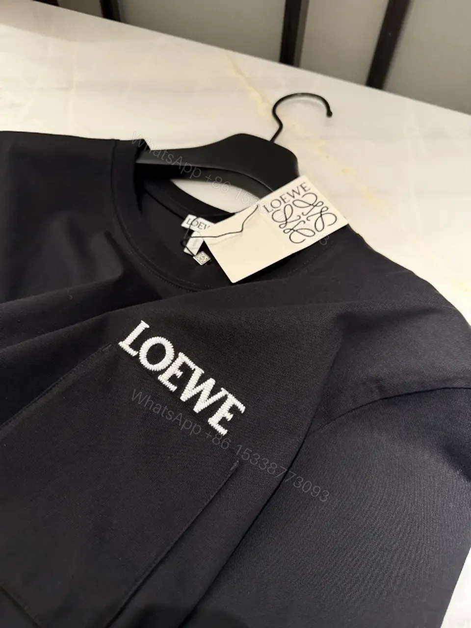 View 9 of Black Cotton Crew Tee with Pocket – Subtle Luxe Comfort