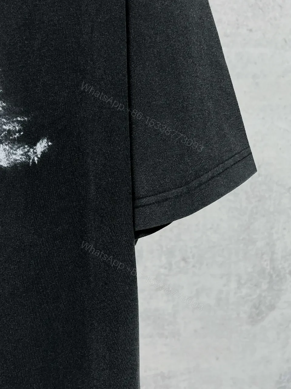View 3 of Oversized Black Cotton Tee with Distressed Logo – Avant-Garde Streetwear