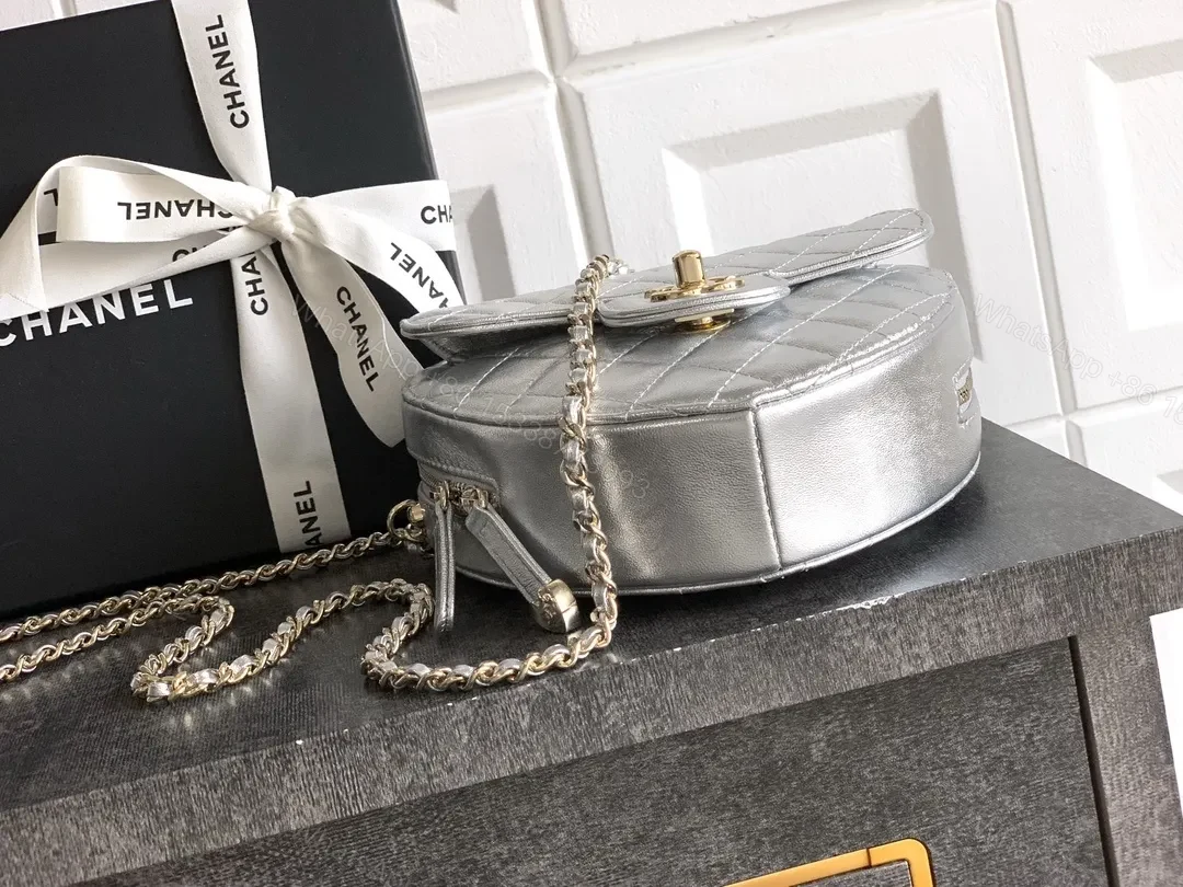 View 5 of Heart-Shaped Quilted Metallic Bag with Gold Hardware