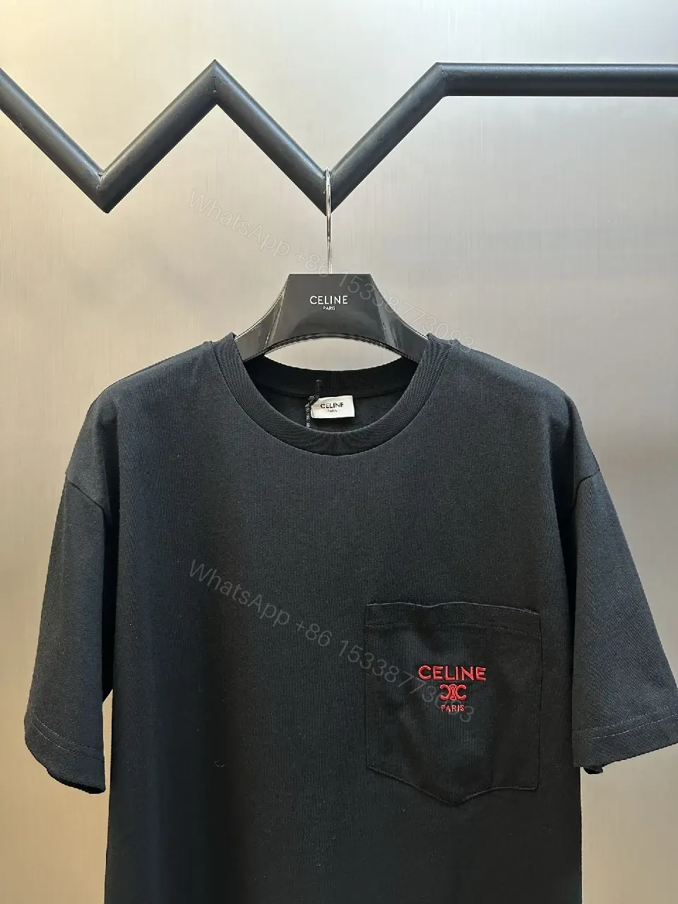 View 7 of Minimalist Black Tee with Red Pocket Detailing - Premium Unisex Tee