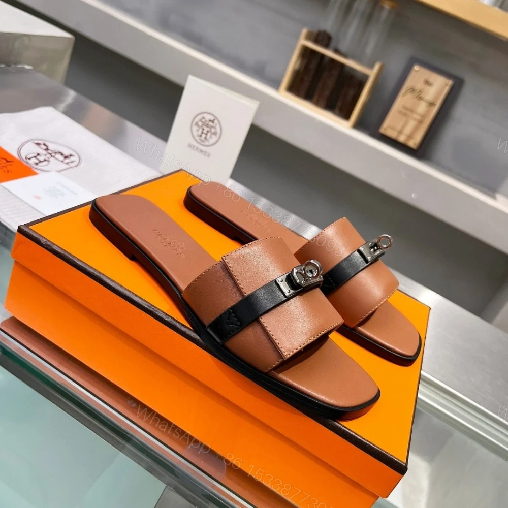 View 3 of HERMES GIULIA SANDAL GOLD AND NOIR H231056Z 20360