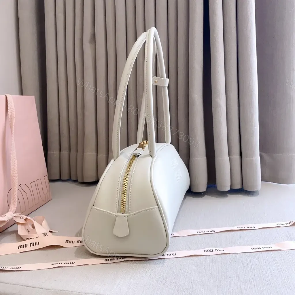 View 6 of Light Leather Dome Bag in Soft Hue, Compact Day-to-Night Carry