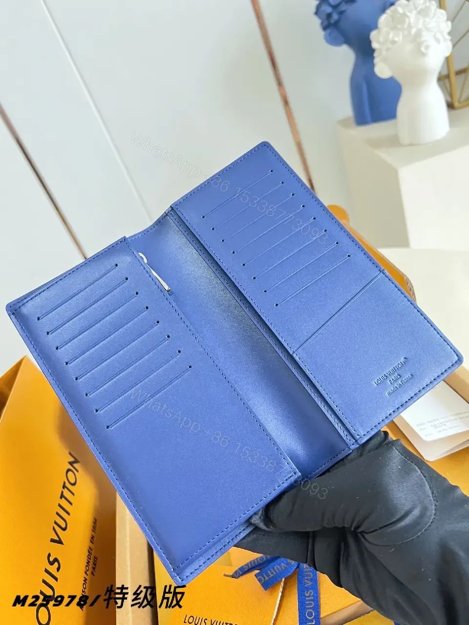 View 4 of Blue Pebbled Leather Wallet, Rectangular, Folded, LV-Embossed Style