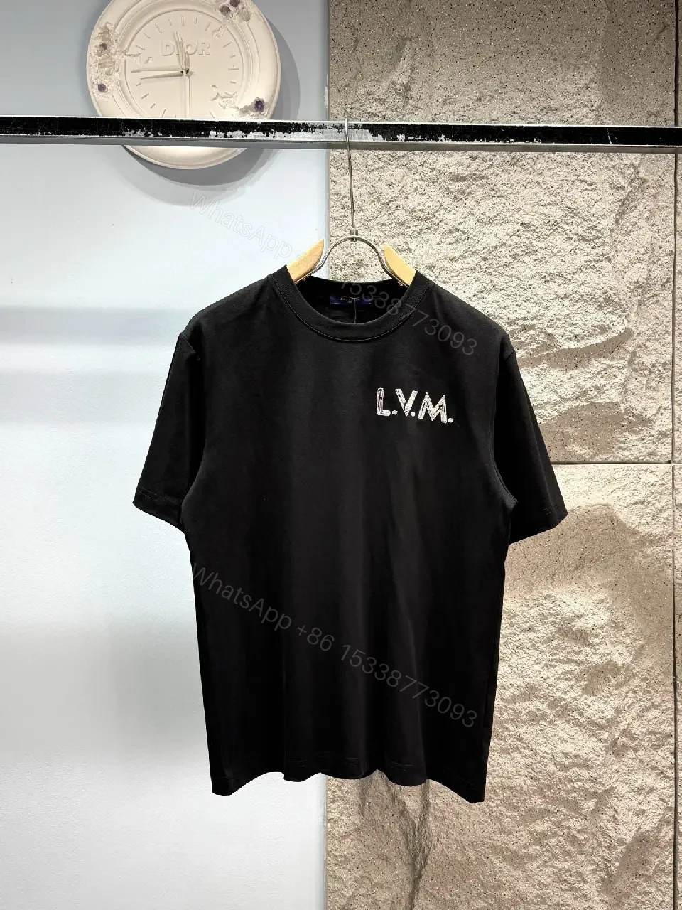 View 6 of Minimalist Black Cotton Tee with Subtle LV.M Logo