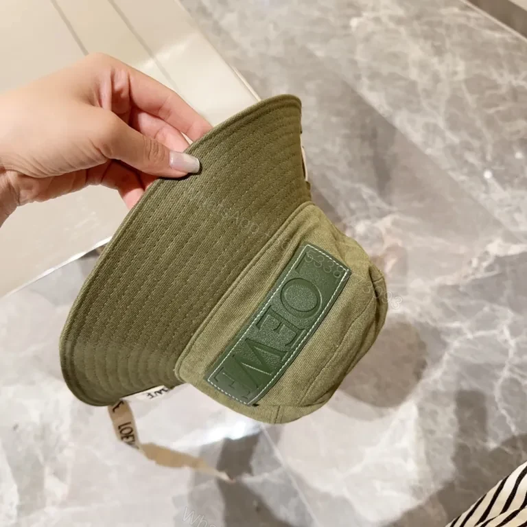 View 7 of Olive Canvas Bucket Hat: Subtle Luxury, LOEWE Patch