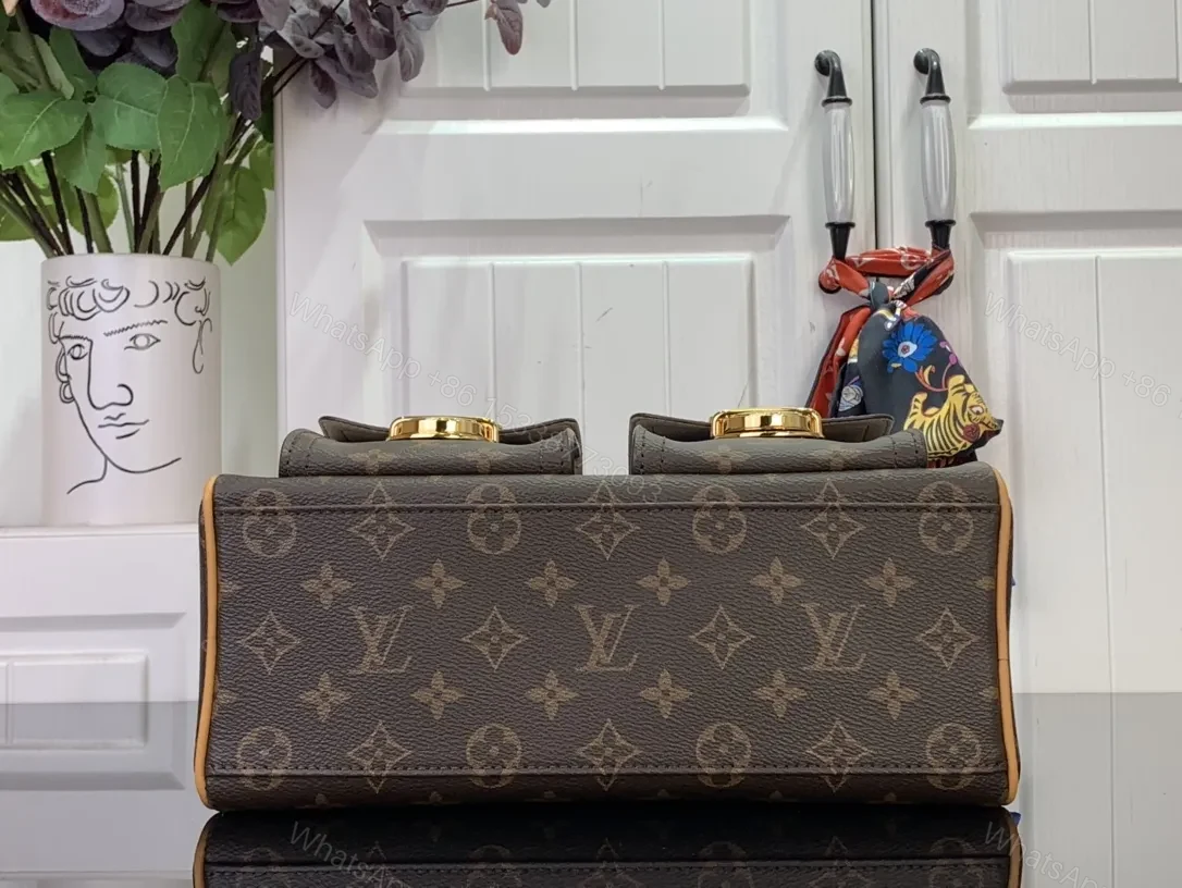 View 8 of Structured Luxury Monogram Handbag with Gold Hardware and Leather Trim
