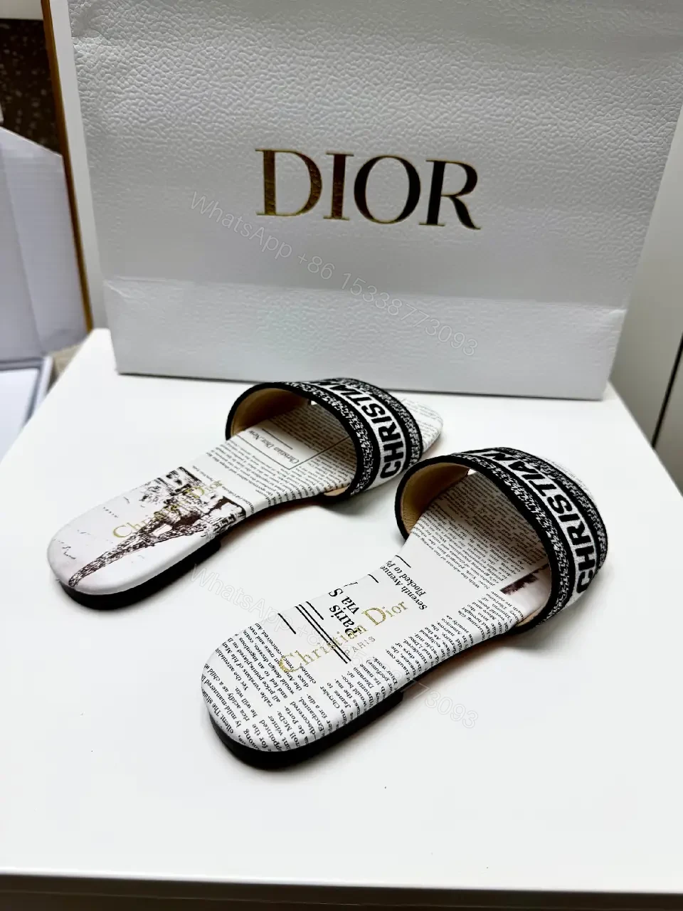 View 3 of white textile slide sandal with monogram pattern luxury logo strap for everyday luxury