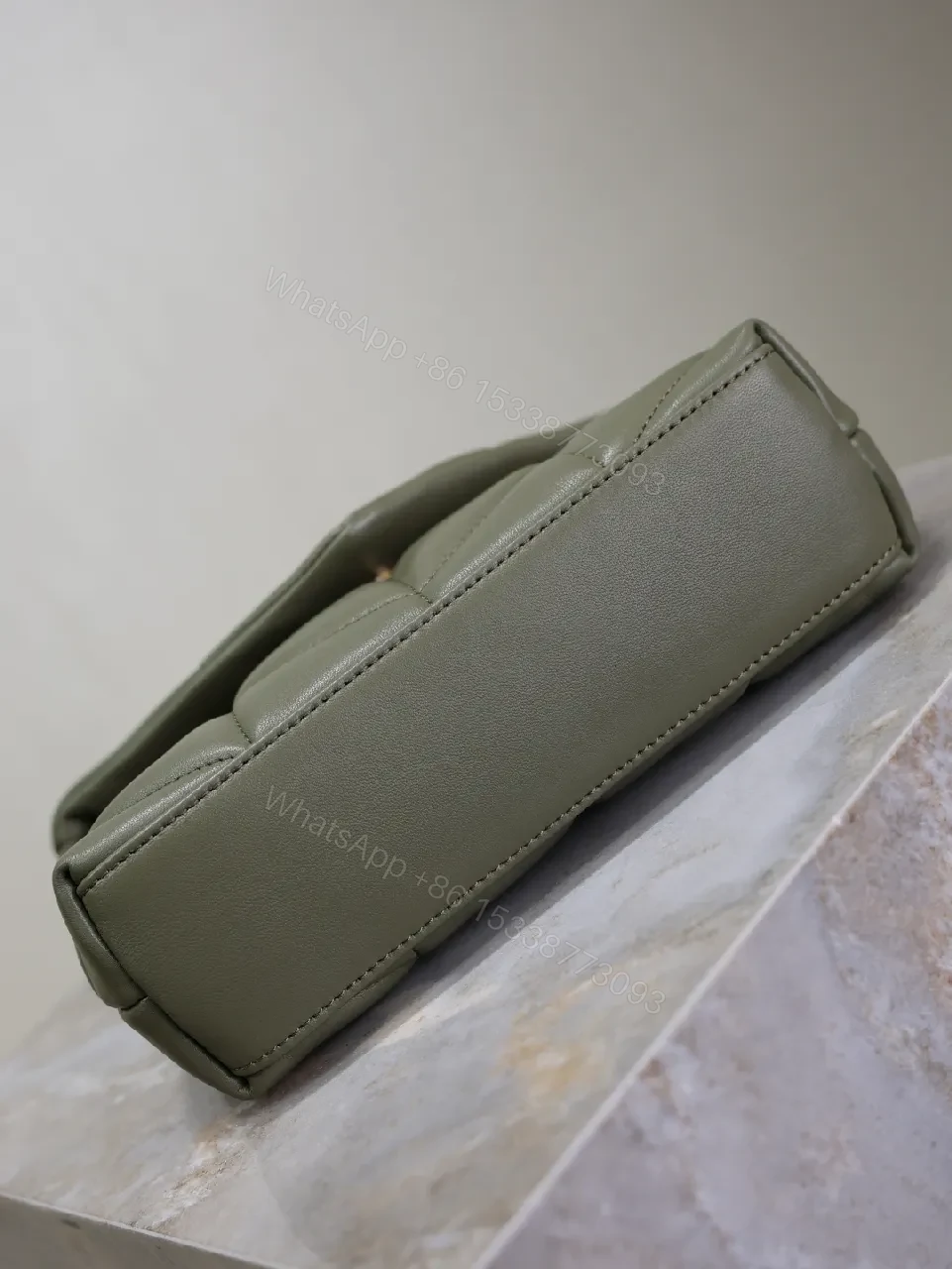 View 5 of Textured Olive Quilted Shoulder Bag with Gold Emblem, Compact Elegant Style