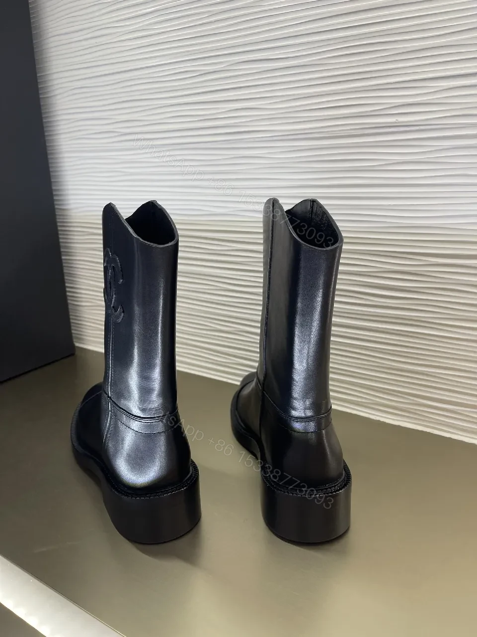 View 9 of Chic Black Leather Knee-High Boots with Logo Embellishment