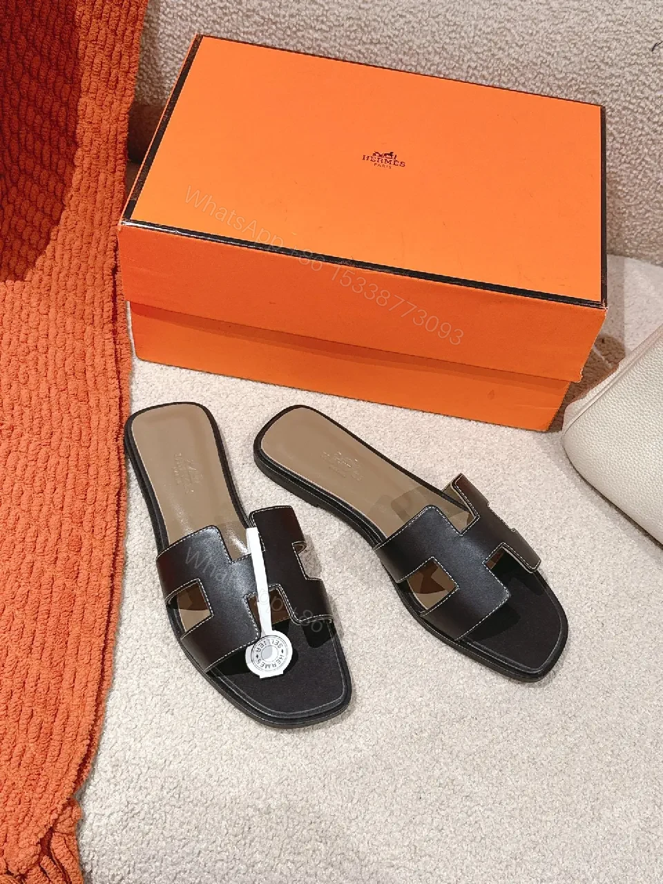 View 7 of Patterned Stride Sandals in Black Leather – Luxury Flat Slides