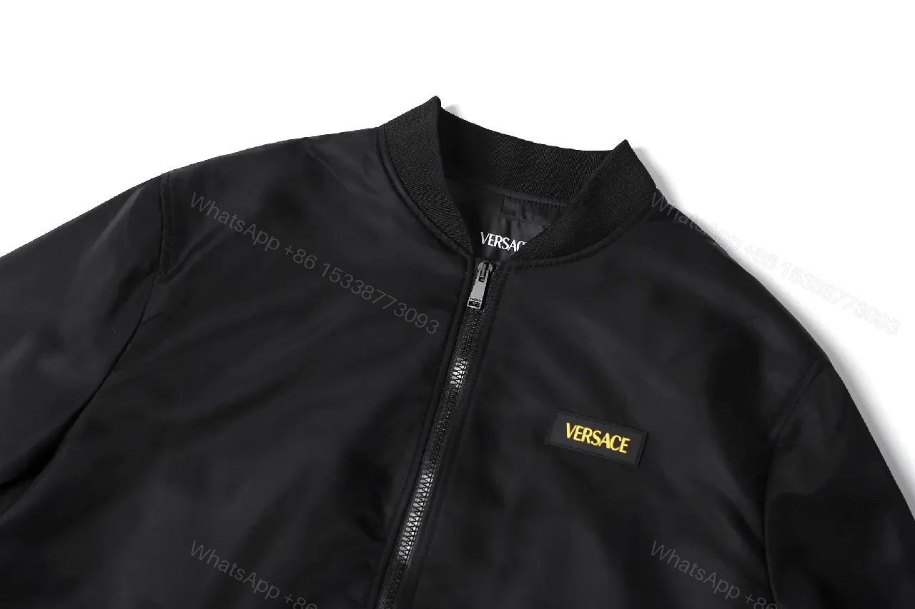View 4 of Minimalist Black Bomber with Gold Accent: Modern Luxury Outerwear