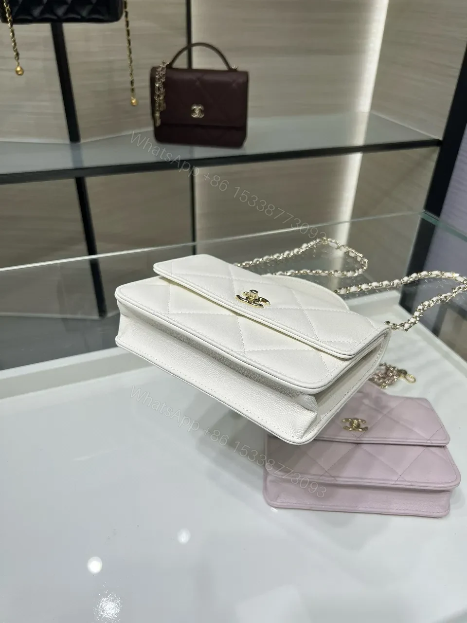 View 2 of White Quilted Mini Bag: Gold Logo, Structured Luxury, Compact