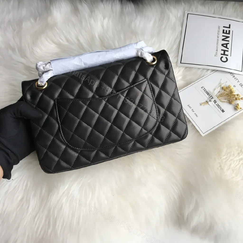View 4 of Quilted Black Handbag with Gold Clasp – Luxe Chic Style