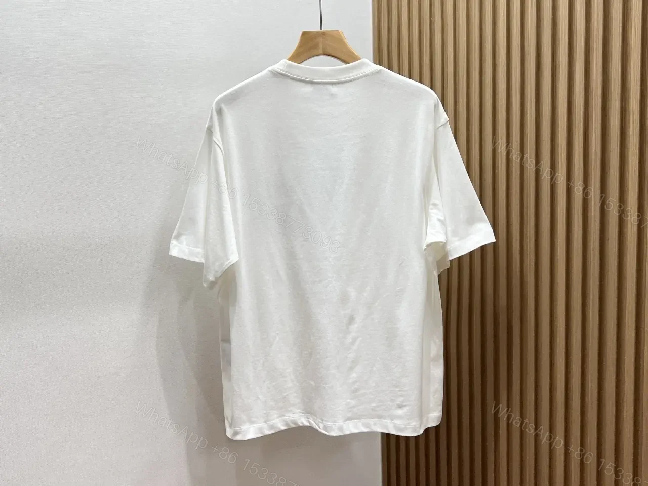 View 3 of Minimalist White Tee with Dior Pocket: Subtle Luxury T-Shirt