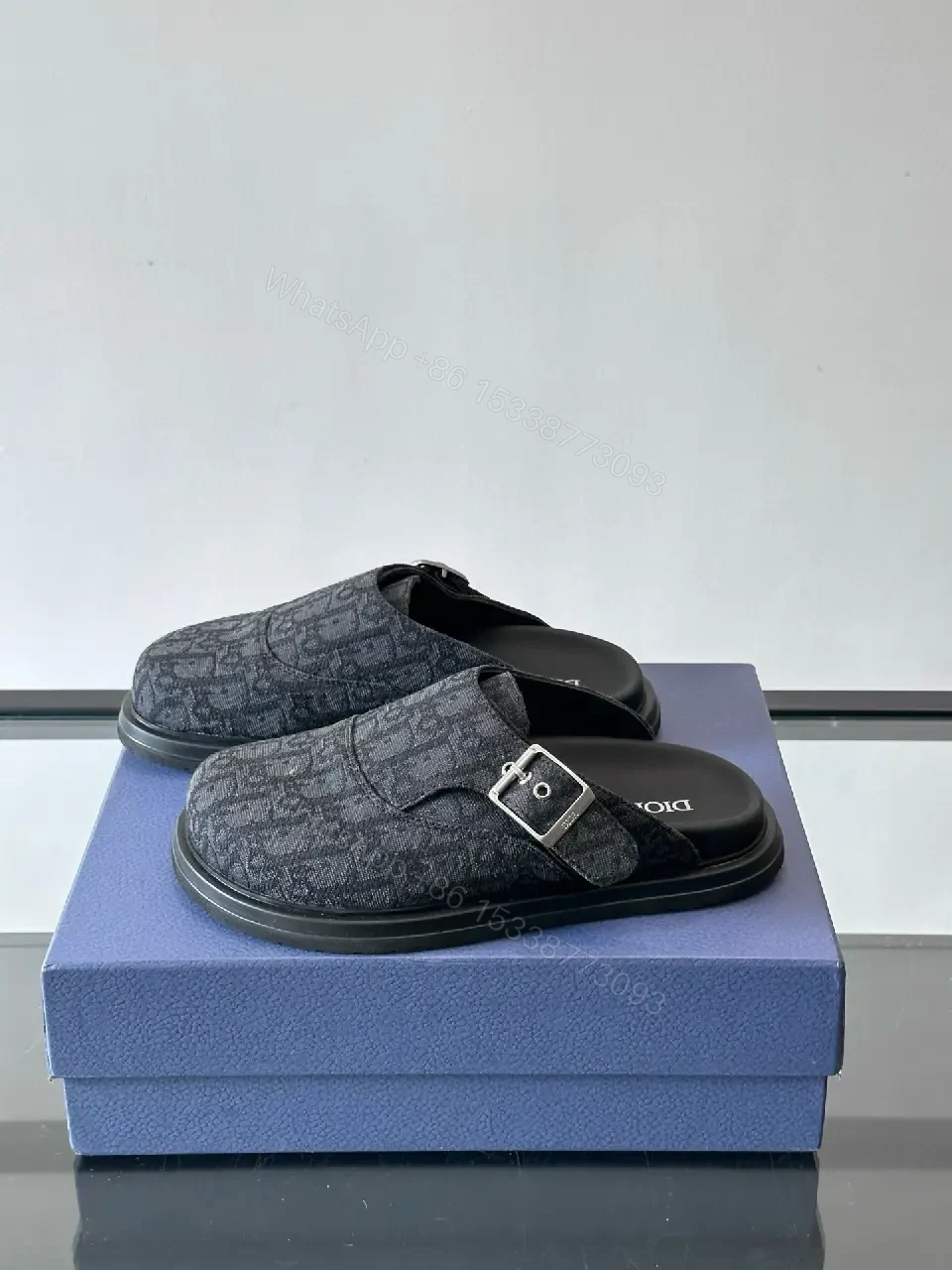 View 7 of Dark Monogram Slip-Ons: Textured Mules with Subtle Buckle