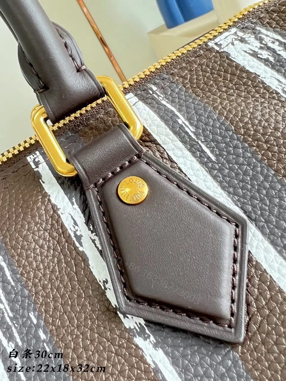 View 4 of Brown leather handbag with striped monogram pattern for luxury everyday use