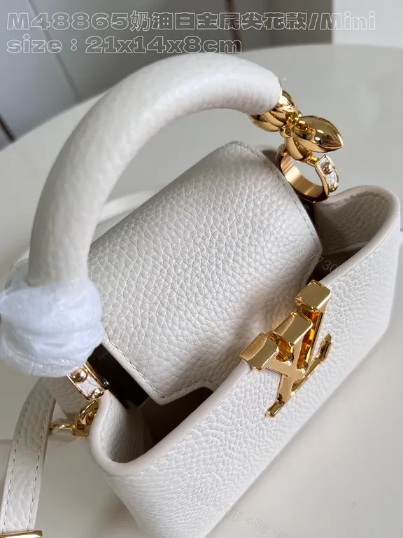 View 3 of Pristine White Pebbled Mini Bag with LV Hardware
