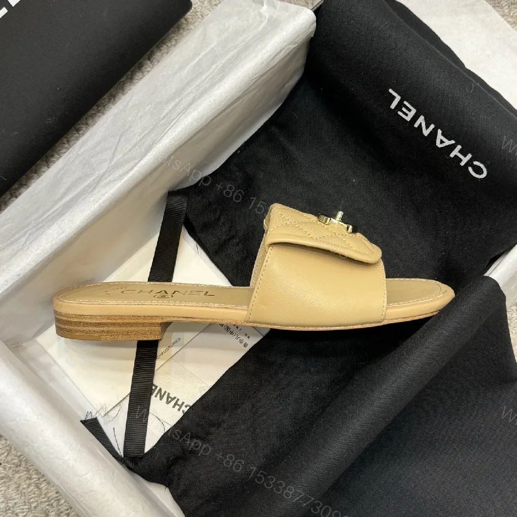 View 9 of Beige Quilted Leather Sliders with Gold Logo—Elegant Comfort
